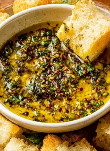 Delicious garlic olive oil dip served with crusty bread for dipping