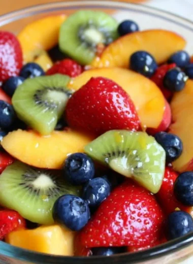 Cozy fruit salad with a mix of fresh fruits in a bowl