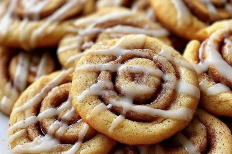 Delicious cinnamon roll cookies with a swirl of cinnamon and icing on top