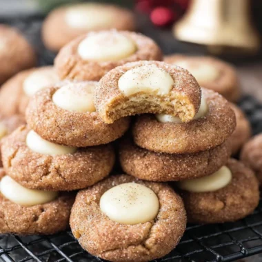 Cozy eggnog snickerdoodle thumbprint cookies decorated for the holidays.