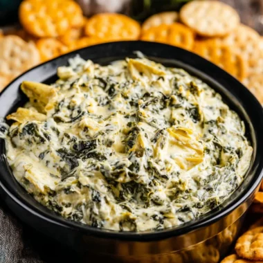 Creamy Crockpot Spinach Artichoke Dip served in a bowl