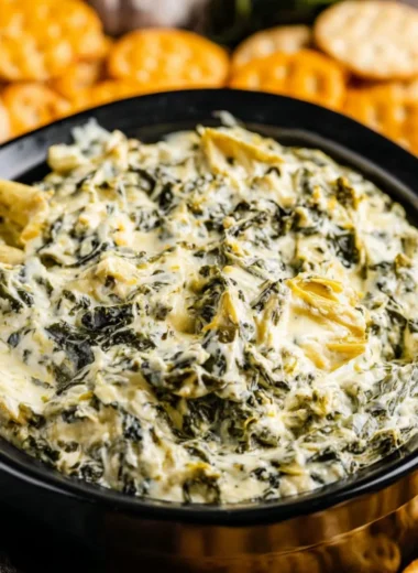 Creamy Crockpot Spinach Artichoke Dip served in a bowl