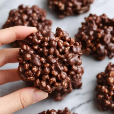 Dark chocolate quinoa crisps in a bowl, showcasing a tasty and healthy snack