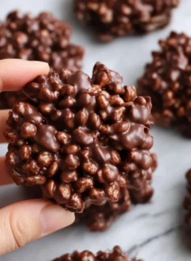 Dark chocolate quinoa crisps in a bowl, showcasing a tasty and healthy snack
