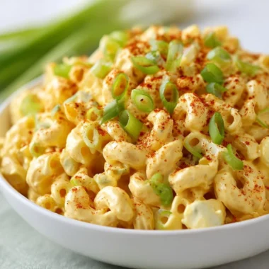 Deviled egg pasta salad with creamy dressing and garnishes