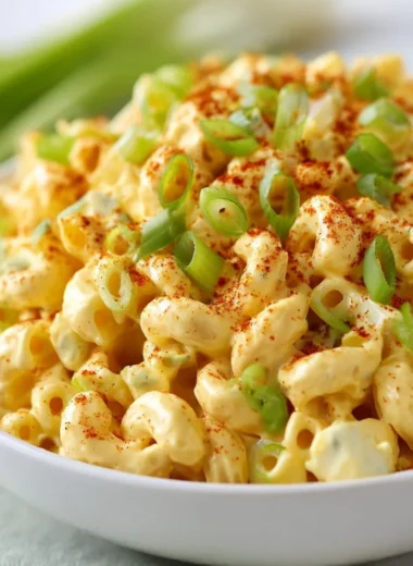 Deviled egg pasta salad with creamy dressing and garnishes