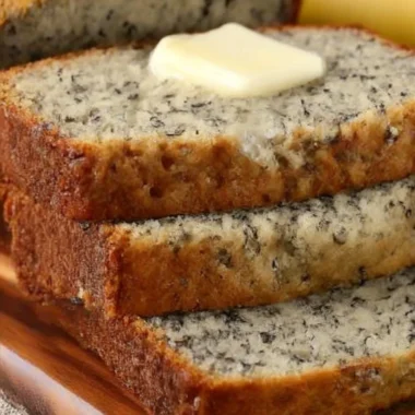Delicious slices of easy homemade banana bread on a wooden table
