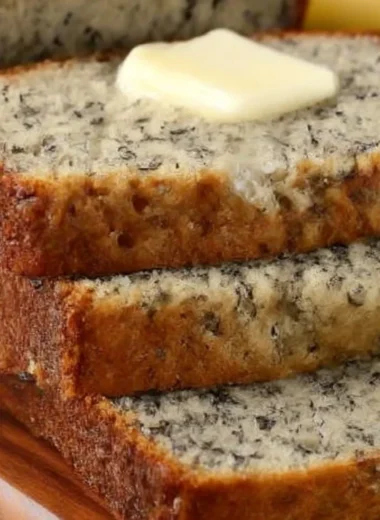 Delicious slices of easy homemade banana bread on a wooden table