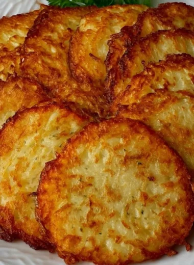 Delicious golden German potato pancakes served with applesauce