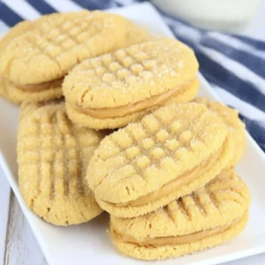 Plate of homemade Nutter Butters cookies with creamy filling