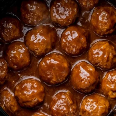 Slow Cooker Salisbury Steak Meatballs served with gravy on a plate