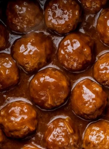 Slow Cooker Salisbury Steak Meatballs served with gravy on a plate