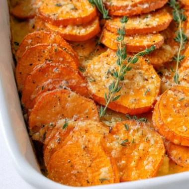 Delicious roasted sweet potatoes served on a wooden plate