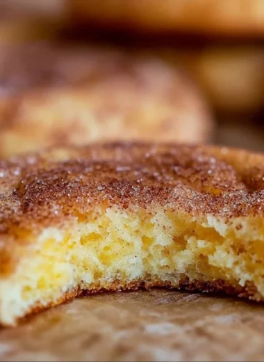 Freshly baked Snickerdoodle Cookies with a sprinkle of cinnamon sugar on top.