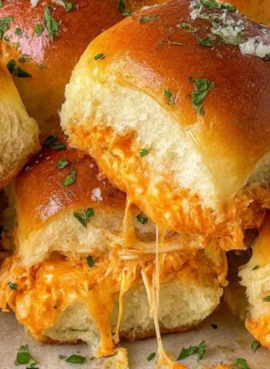 Delicious spicy Buffalo chicken sliders served on a platter.