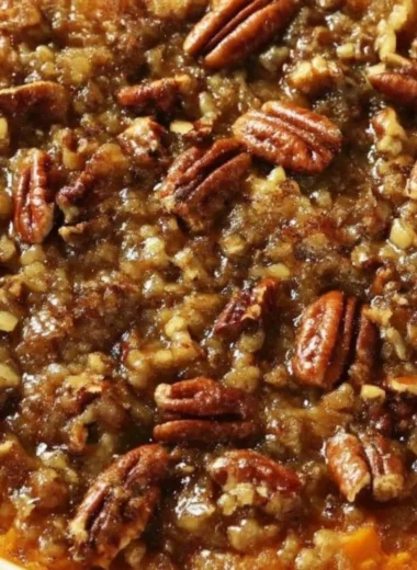 Delicious sweet potato casserole topped with marshmallows and pecans