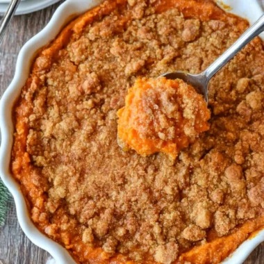 Creamy sweet potato casserole topped with marshmallows, a perfect fall dish