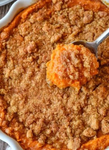 Creamy sweet potato casserole topped with marshmallows, a perfect fall dish
