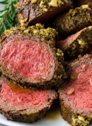 Juicy beef tenderloin cooked to perfection, garnished and ready to serve.