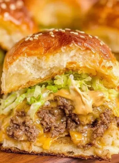 Delicious Big Mac Sliders served on a rustic wooden table