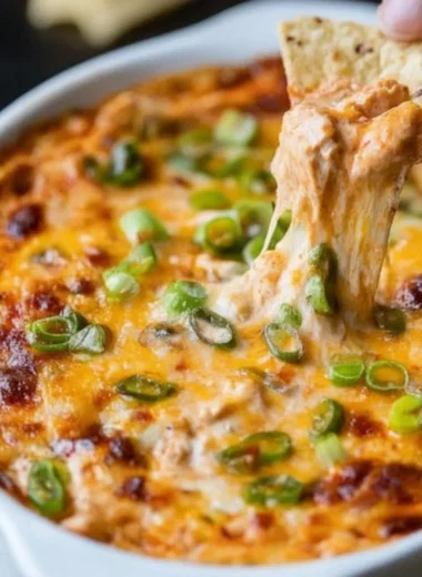 Delicious creamy Buffalo Chicken Dip with melted cheese and chicken