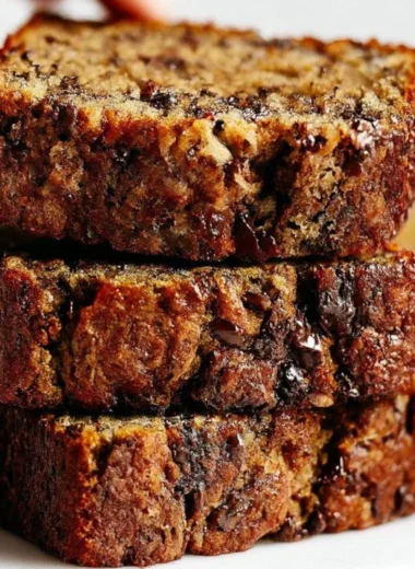 Slice of homemade chocolate chip banana bread with chocolate morsels
