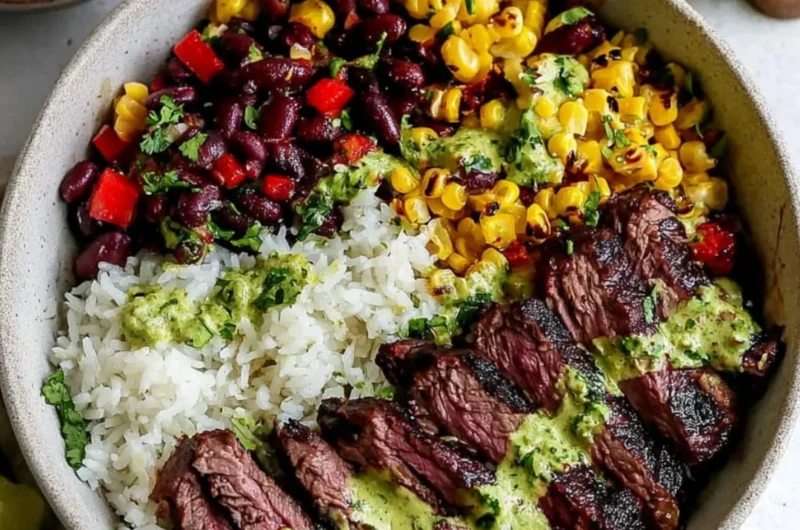Bowl of cilantro lime steak with fresh vegetables and rice.