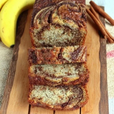 Freshly baked cinnamon swirl banana bread with warm spices and ripe bananas.