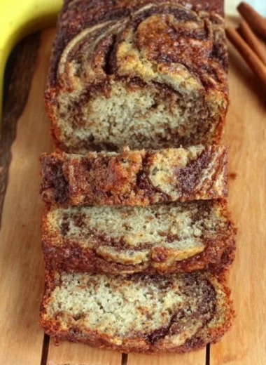 Freshly baked cinnamon swirl banana bread with warm spices and ripe bananas.