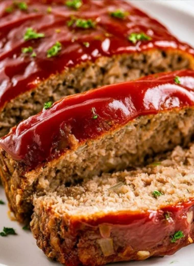 Classic Meatloaf served with mashed potatoes and glazed carrots