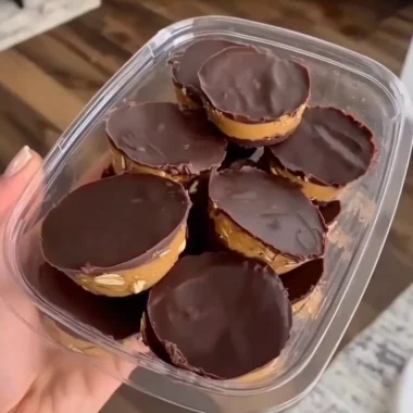 Delicious no bake peanut butter oat cups served on a wooden table.