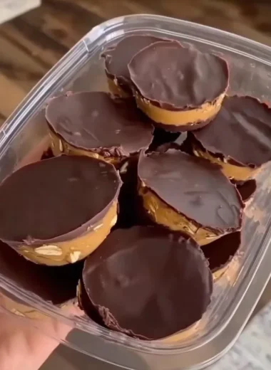 Delicious no bake peanut butter oat cups served on a wooden table.