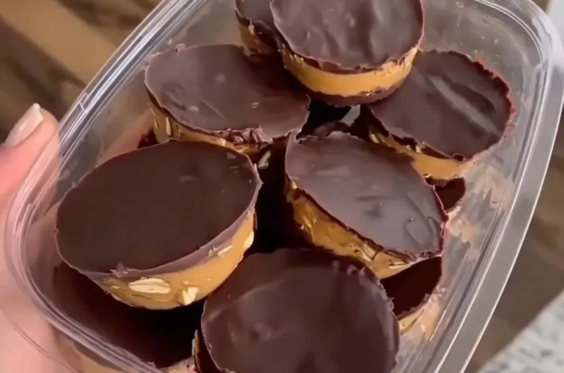 Delicious no bake peanut butter oat cups served on a wooden table.