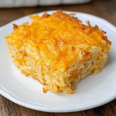 Delicious Cracker Barrel Hash Brown Casserole with cheese and crispy topping