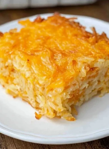 Delicious Cracker Barrel Hash Brown Casserole with cheese and crispy topping