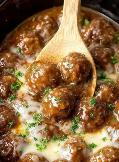 Crock-Pot French Onion Meatballs simmering in a savory sauce.