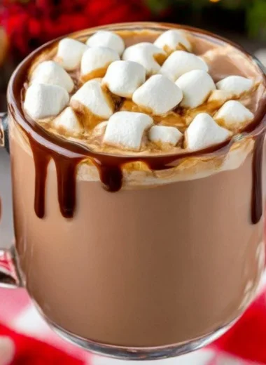 Delicious crockpot hot chocolate served in a mug topped with marshmallows