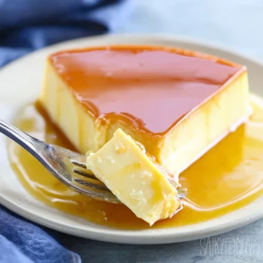 Delicious homemade caramel flan dessert topped with golden caramel sauce.