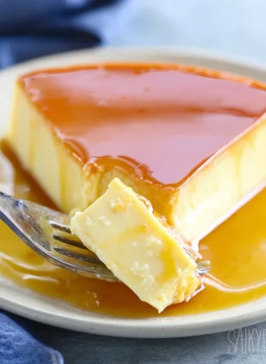 Delicious homemade caramel flan dessert topped with golden caramel sauce.