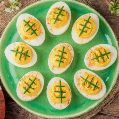 A platter of Football Deviled Eggs decorated for game day