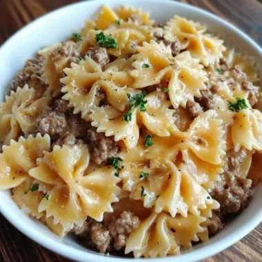 Delicious Garlic Butter Beef served with Cheesy Bowtie Pasta on a plate