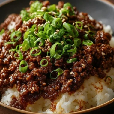 Korean Ground Beef Bowl garnished with vegetables and sesame seeds