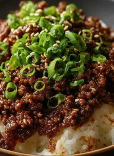 Korean Ground Beef Bowl garnished with vegetables and sesame seeds
