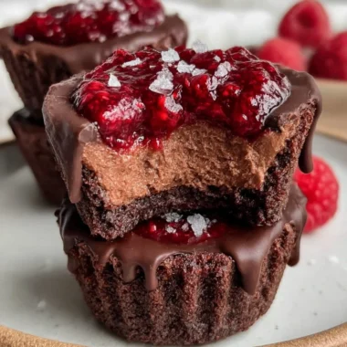 No-bake raspberry chocolate mousse cups topped with fresh raspberries