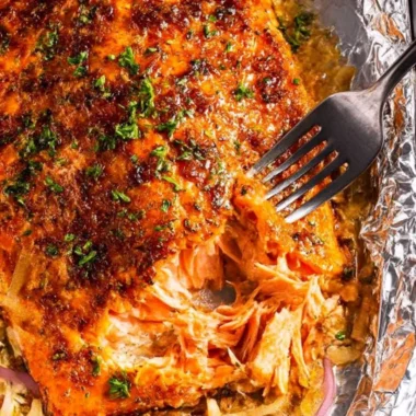 Delicious oven baked salmon garnished with herbs and lemon