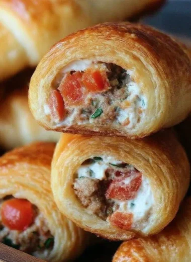 Sausage, Rotel, and cream cheese filling in golden crescent rolls
