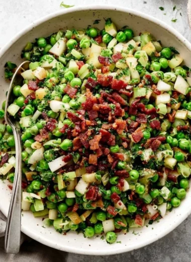 Thanksgiving pea salad with pancetta and pears served in a bowl