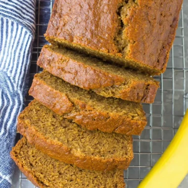 Slice of healthy banana bread on a wooden table