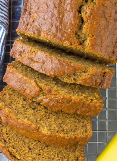 Slice of healthy banana bread on a wooden table