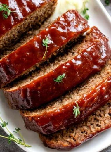 Ultimate meatloaf recipe showcasing tender and flavorful meatloaf sliced on a plate